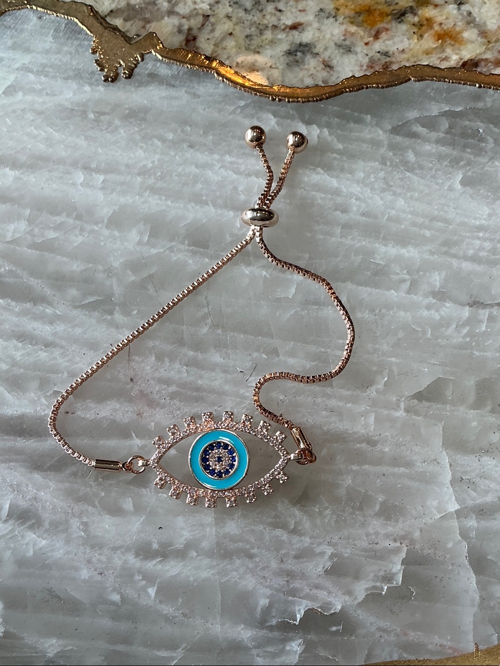 Rose Gold Evil Eye Slider Bracelet with Blue Center
